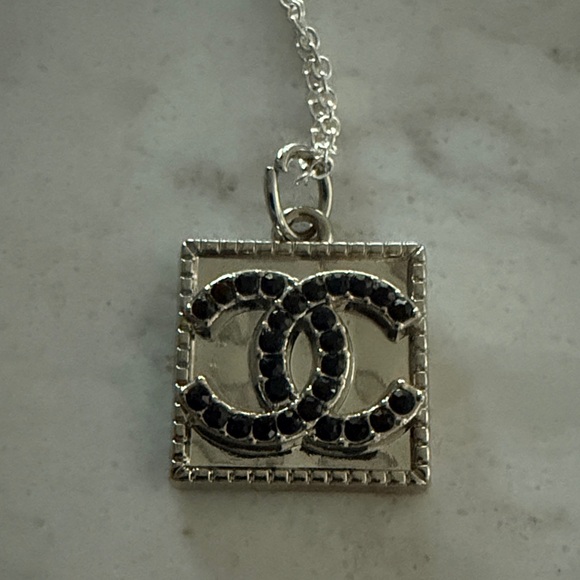 CHANEL Jewelry - CHANEL Black and Silver Charm with unbranded silver chain